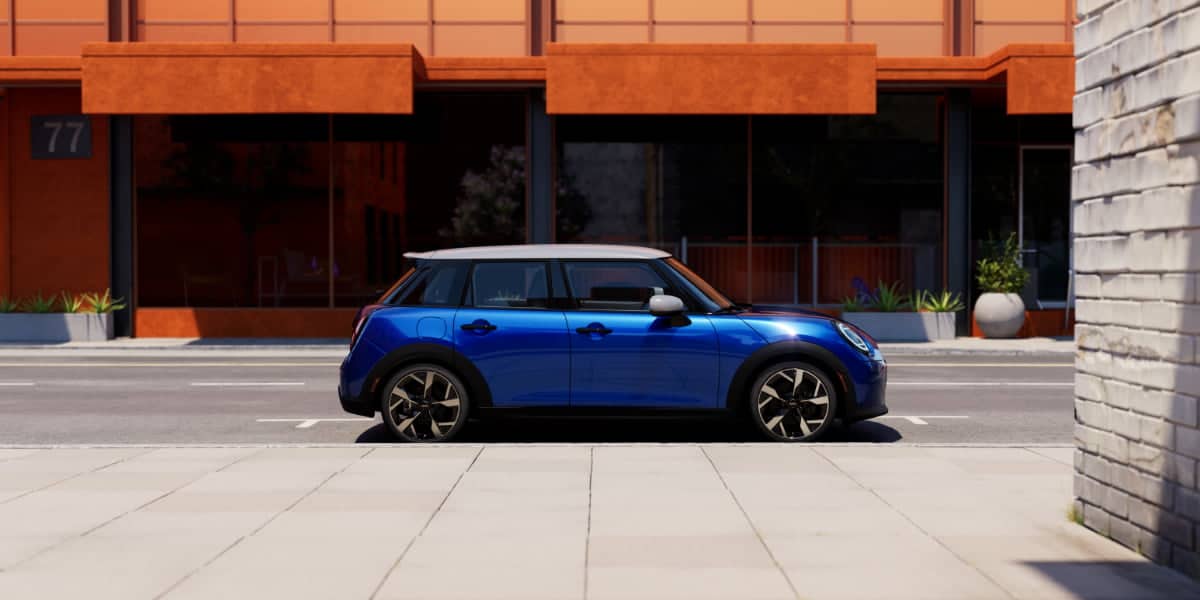 A blue MINI Cooper parked on a city street. While a 4 door MINI Cooper Convertible doesn’t exist, this model showcases MINI’s compact design and stylish appearance.