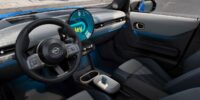 Interior view of a 2025 Mini Cooper with digital display and sleek modern design, supporting blog topic on how much are mini coopers