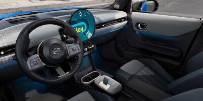 Interior view of a 2025 Mini Cooper with digital display and sleek modern design, supporting blog topic on how much are mini coopers